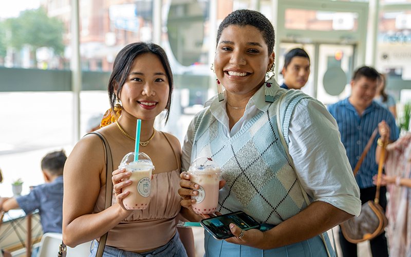 beautiful-asian-and-african-american-woman-posing-in-boba-cafe